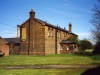 The back of the transport yard buildings. Originally the transport yard would have contained the horses for the ‘trambulance’. The top windows are the accommodation rooms for the male workers